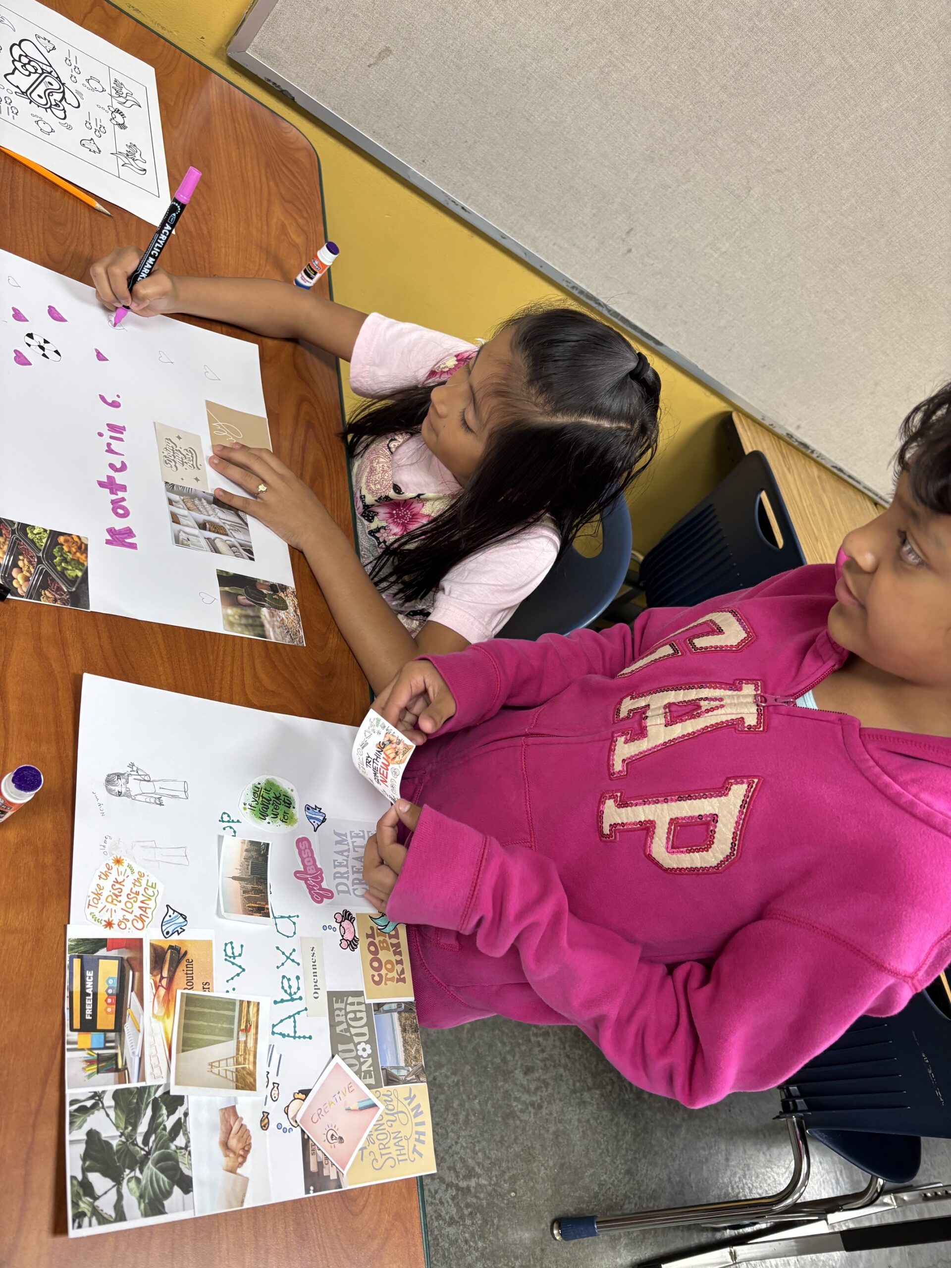 Kids making collages on desks