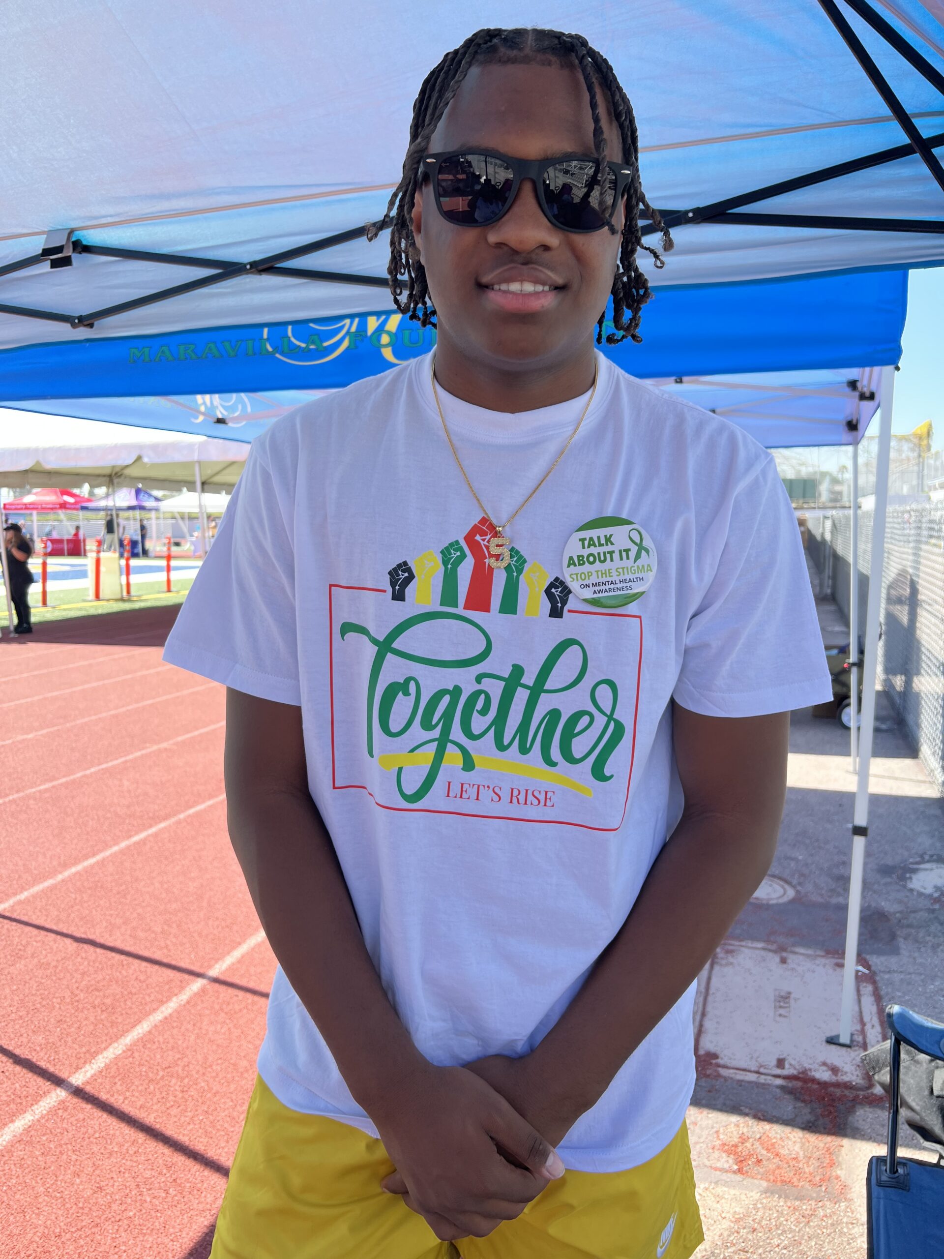 Teenager in "Together" t-shirt
